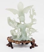 Carved Chinese green hardstone sculpture of two birds perched on flowering prunus, one with its