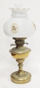 Late 19th / early 20th century brass oil lamp with gadrooned decoration together with an opaque