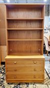 Mid-century G-Plan teak wall unit, the upper section with three open shelves, the lower section with