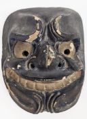 Japanese carved lacquered and painted noh mask, early 20th century, with stylised features,