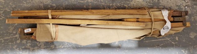 Army-style vintage folding wooden and canvas camp bed