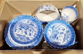 Blue and white willow pattern part tea set comprising cake plates, saucers, sugar bowl etc.