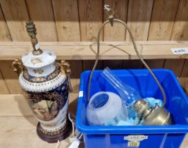 Porcelain table lamp decorated with panels of cherubs, 56cm high and a hanging oil lamp with