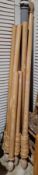 Four limed wooden curtain rails with pineapple carved finials and wooden curtain rings together with