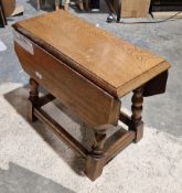 Oak folding coffee table on turned and block legs, 44cm high x 58cm wide