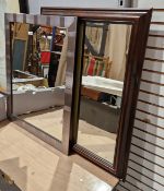 Two modern rectangular wall mirrors, one with a wooden frame, the other with a metallic-effect