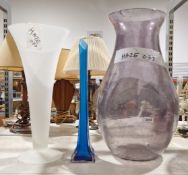 Three large glass vases inculding a blue tapered stem vase, a large purple baluster vase and a white