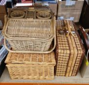 Three wicker picnic baskets, two filled with picnic items (3)