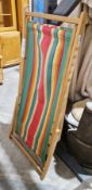 Two wooden framed folding deckchairs with striped canvas seats (2)