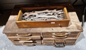 Late 19th/early 20th century wooden tool cabinet comprising a bank of ten short drawers filled