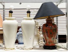 Chinese-style baluster ceramic vase decorated with flowers on a red ground and a pair of cream
