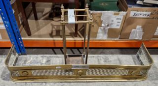 Edwardian brass four-section stickstand, 57cm high and a 19th century brass fender, 119cm long (2)