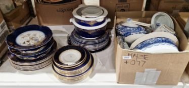 Early 20th century George Jones part dinner service decorated with a colbalt blue and gilt border,