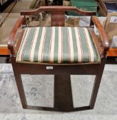 Mahogany-effect piano stool with green striped upholstered lift seat, opening to a selection of
