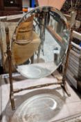 Oval swing dressing mirror on an oak stand, 55cm high
