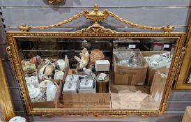 V Four modern mirrors, one in the Regency style, the gilt frame with urn and swags cresting, 75cm