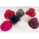 A collection of various felt hats, and others, and Aran knitted scarf with Aran mittens and an