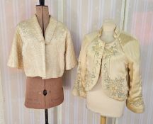 A quilted satin embroidered evening jacket, and another (2)