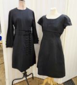 Black cocktail dress labelled 'Blanes', fitted waist, cap sleeves, braid adornment to the empire