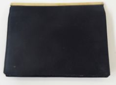 An Asprey black fabric evening bag with silver hardware, flap front fastening with pockets for