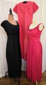 Black crocheted maxi dress over a black lining, labelled 'Young Mayfair, Hershelle', empire line