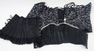 Black corset labelled Axfords of Brighton, a black bustier labelled 'The English Rose', size 34B,