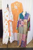 A cotton dressing gown, labelled Andrew Russell, printed with roses, embroidery anglaise trim with