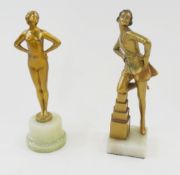 Art Deco bronzed figure of girl in short dress kneeling on stepped blocks, on green alabaster