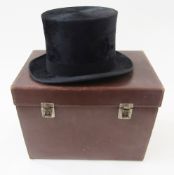 A silk top hat labelled Tress & Co. London with its original leather fitted case, internal