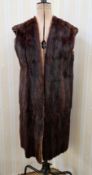 A sleeveless vintage fur gilet, full length, collarless, sleevelss, no lining, the mink dyed in