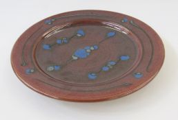 Ray Finch (1914-2012) for Winchcombe pottery, a stoneware charger, enriched in an iron glaze with