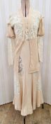 1920's/30's dress and jacket, pale apricot with lace inserts, the leg o'mutton-style sleeves with