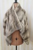 WITHDRAWN - A grey mink evening jacket, with a full front, and pockets, elbow length sleeves The