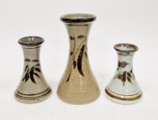 Jeremy Leach (b.1941) for Lowerdown pottery, three vases of narrow waisted form, with brushwork leaf