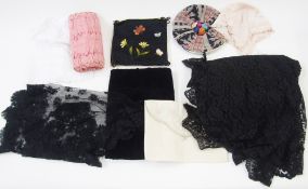 A vintage black lace shawl, a large length of black lace with scalloped edge possibly a shawl or a