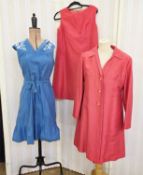 A blue cotton sleeveless shift dress, labelled Linzi, the yoke printed with white daisies, tie belt,