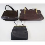 Three vintage handbags, a brown suede bag with brown leather trim, brass coloured hardware, the
