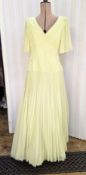 Emanuel yellow chiffon evening dress, drop waist, pleated skirt over stiff petticoats, the bodice