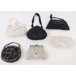 Various mid-century evening bags to include a black suede bag with diamante detail, the handle