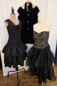 Gina Bacconi black cocktail dress, puffball skirt, fitted body, scoop neck with fabric rose to the