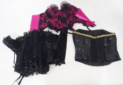 Various corsets and bustiers to include a black and pink Victoria's Secret corset with suspenders, a