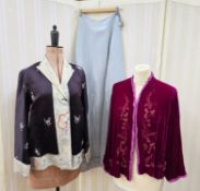 A black Chinese silk jacket, embroidered border and collar, embroidered with flowers, the back of