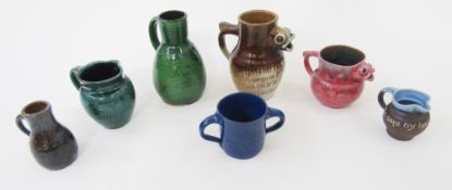 Collection of William Baron Barnstaple Art Pottery commemorative incised jugs, early 20th century,