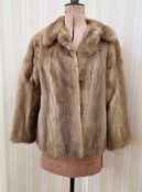 A pale brown mink jacket, labelled Faulkes Edgbaston Birmingham, with a pink and orange