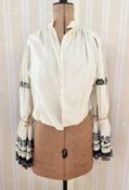 A cream cotton peasant style blouse, mid century , round neck, full sleeves gathered at the wrist