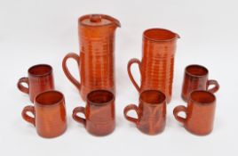 V 1970s Fowey pottery orange glazed coffee-service, impressed seal, comprising: a tall cylindrical