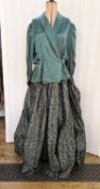 Hardy Amies dark green satin skirt decorated with silver whorls, with a dark green satin matching
