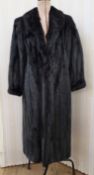 A Smith & Son of Montreal black mink coat, hook fastening, satin lining, cuffed sleeves, with