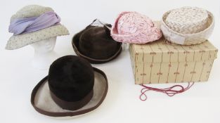 Quantity of vintage hats, to include a net and feathered cap labelled Lady Fashion, a black velvet