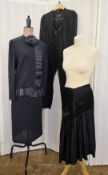 A Jaeger trouser suit labelled Jaeger Black, the jacket with black button fastening, the cuffs